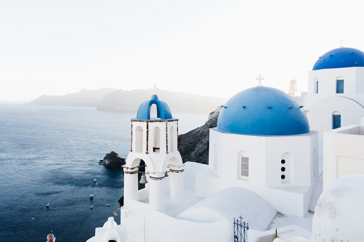 Oia village overlooking the sea at sunset on Santorini, Greece